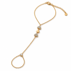 Aurelia gold-tone haathphool hand chain with delicate linked chains, round pavé stone motifs and bezel-set accents styled on a woman's hand by INDAAH.