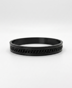 Dark industrial-finish kada bracelet with link detailing for men.