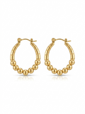 Pair of high-polish gold oval hoop earrings featuring a ribbed top and graduated beaded lower curve on a white background.