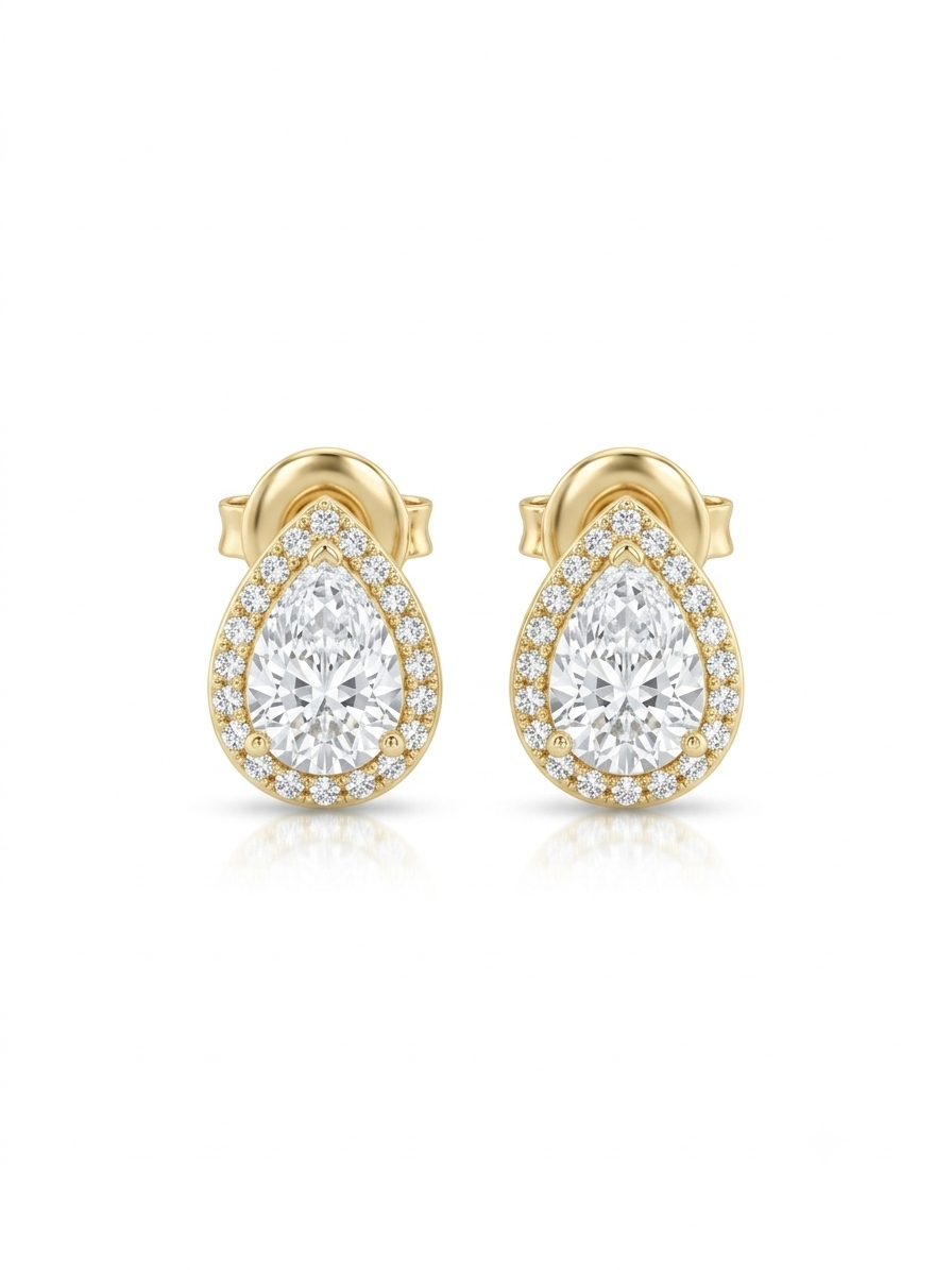 Pair of gold stud earrings featuring pear-cut clear stones encircled by a sparkling halo on a white studio background.