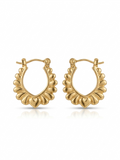 Pair of polished gold oval hoop earrings featuring a scalloped outer rim and a central heart motif on a white studio background.