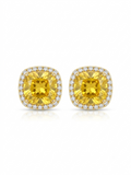 Pair of gold stud earrings featuring yellow cushion-cut center stones surrounded by clear pavé halo borders on a white studio background.