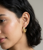 Shop our Matte Gold Sculptural Chunky Half-Hoop Earrings. Lightweight, elegant, and featuring a modern brushed finish—the perfect everyday statement piece.