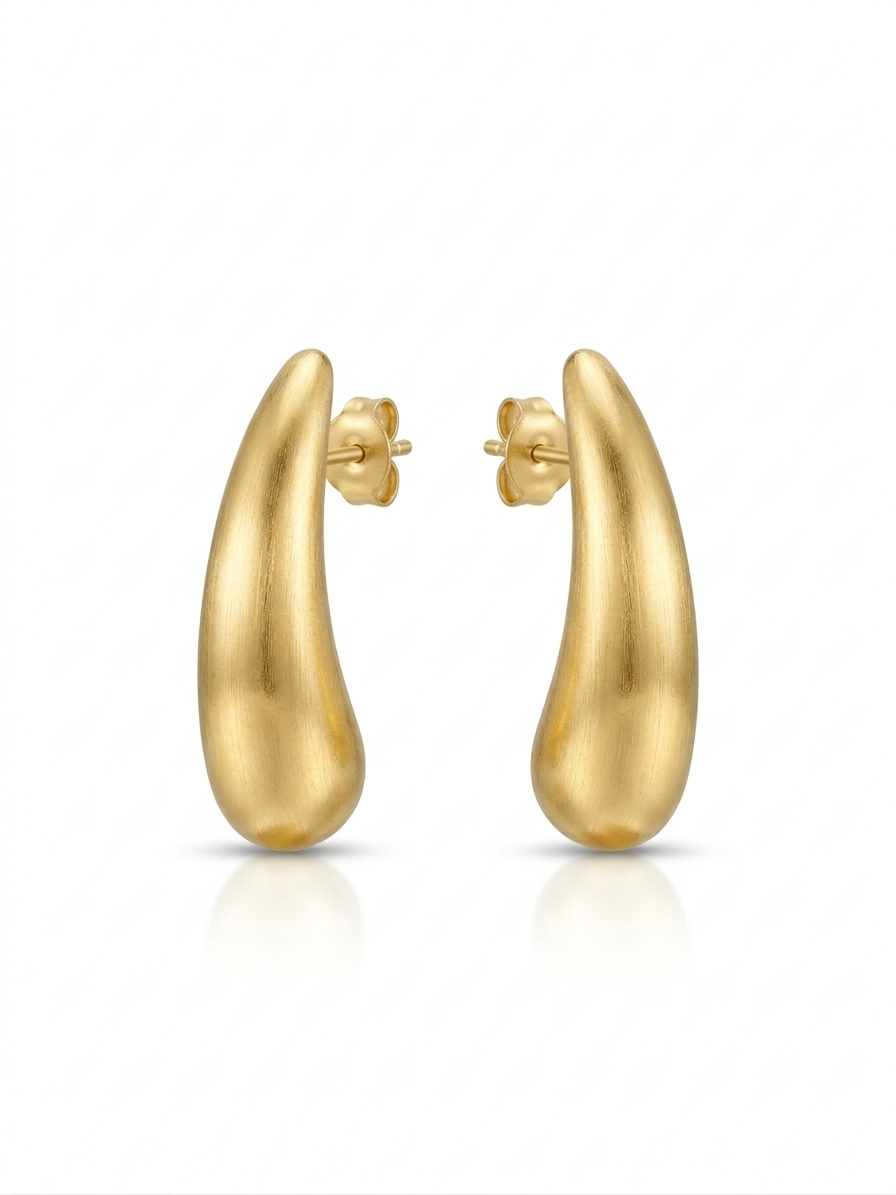 Pair of elongated matte gold teardrop-shaped stud earrings with post backs displayed against a white background.