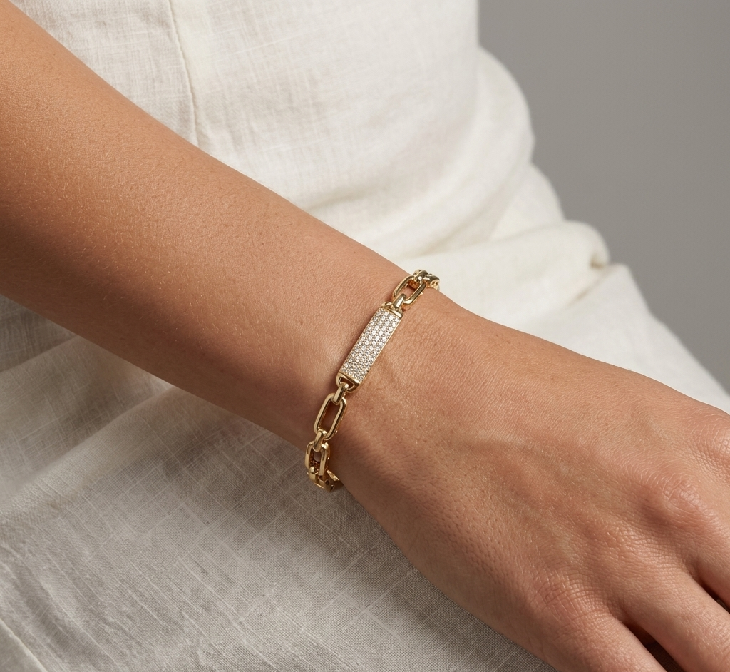 Model wearing Anti-tarnish 18K gold-plated crystal bar bangle.