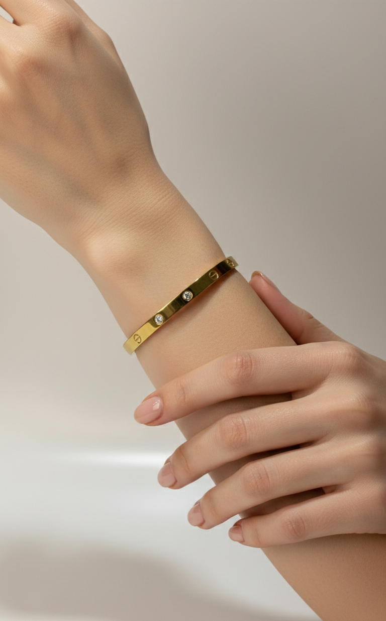 Model wearing Anti-tarnish 18K gold-plated emerald-cut bangle.
