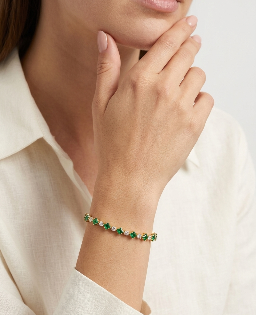 Model wearing Anti-tarnish 18K gold-plated green stone tennis bracelet.