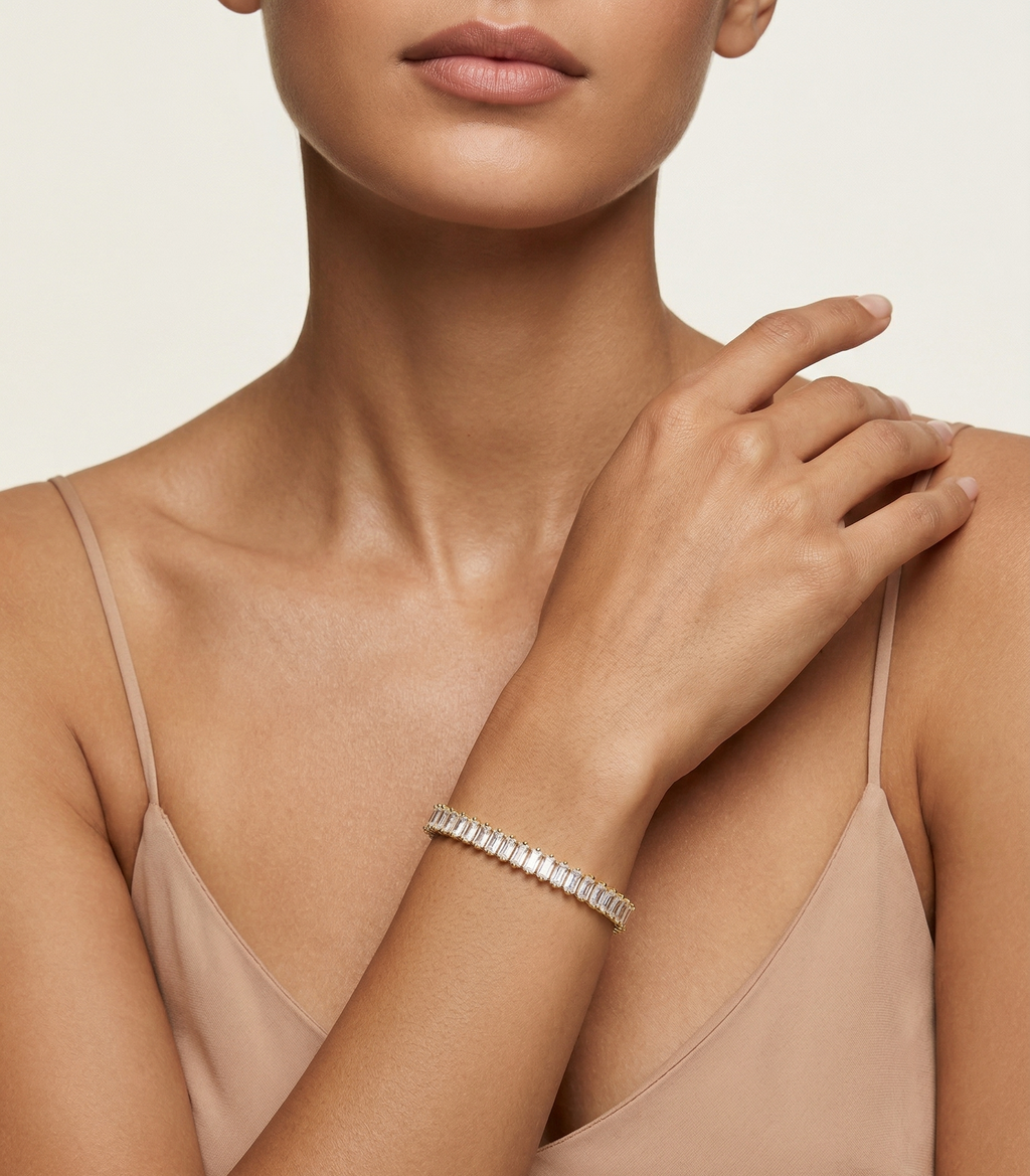 Model wearing Anti-tarnish 18K gold-plated linear tennis bracelet.