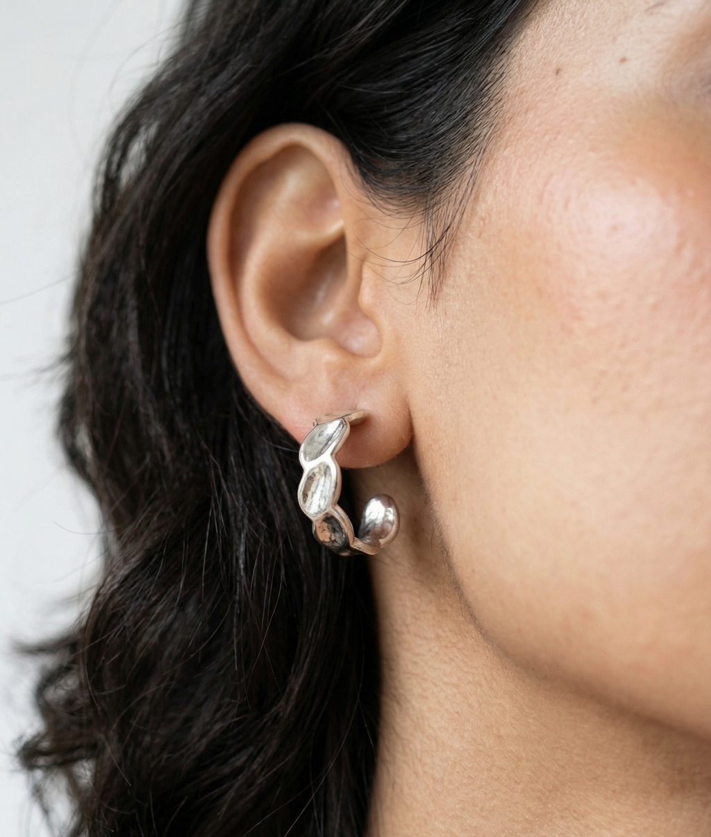 Model wearing Pear-shaped drop earrings.