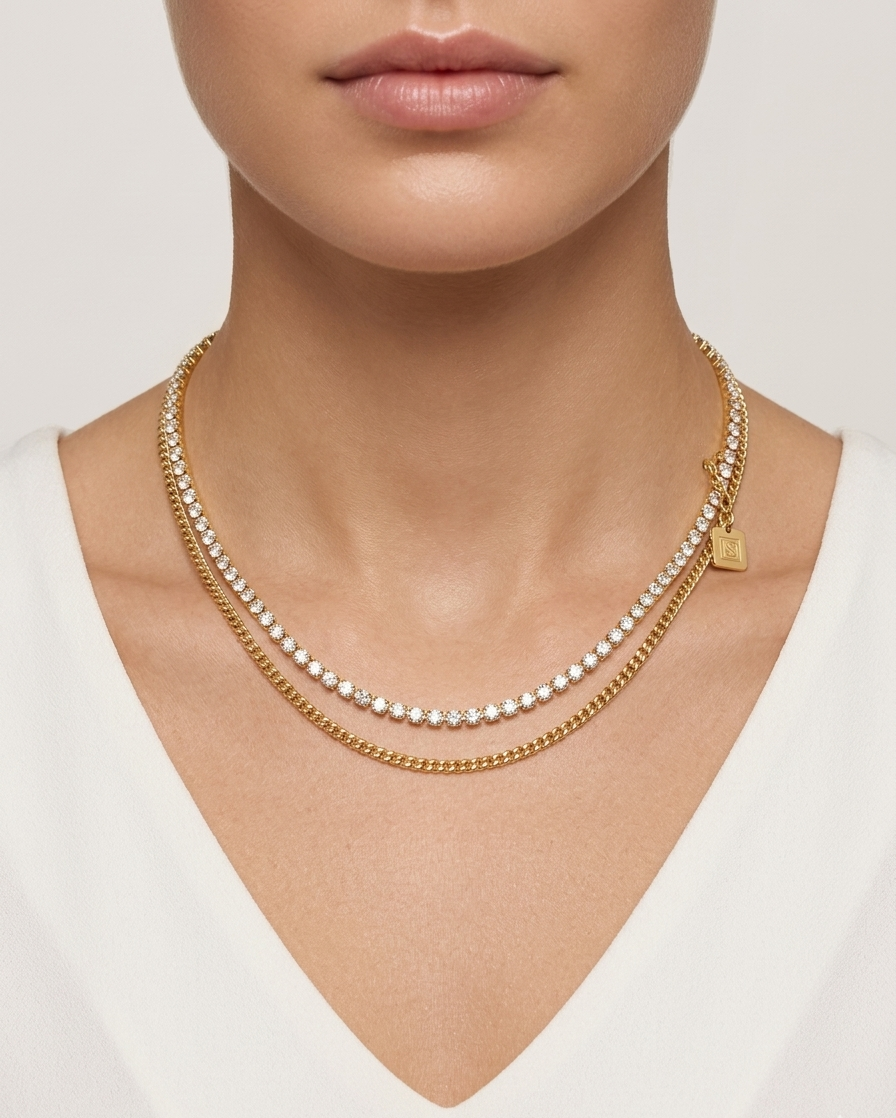 Modle wearing Anti-tarnish 18K gold-plated layered tennis and curb chain necklace.