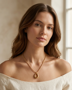 Modle wearing Anti-tarnish 18K gold-plated open oval pendant necklace.