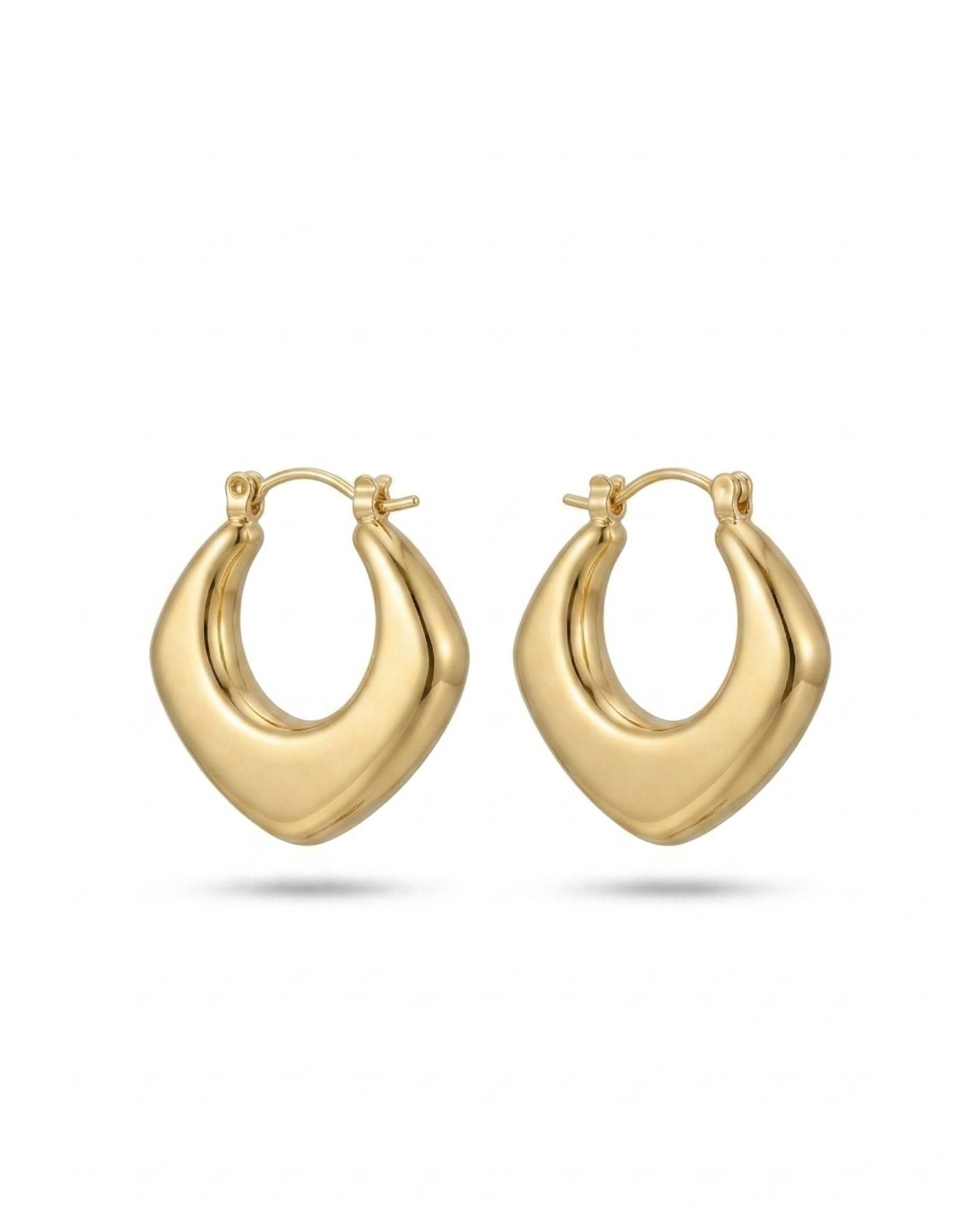 Sculpted gold-plated hoop earrings with a diamond-textured design.