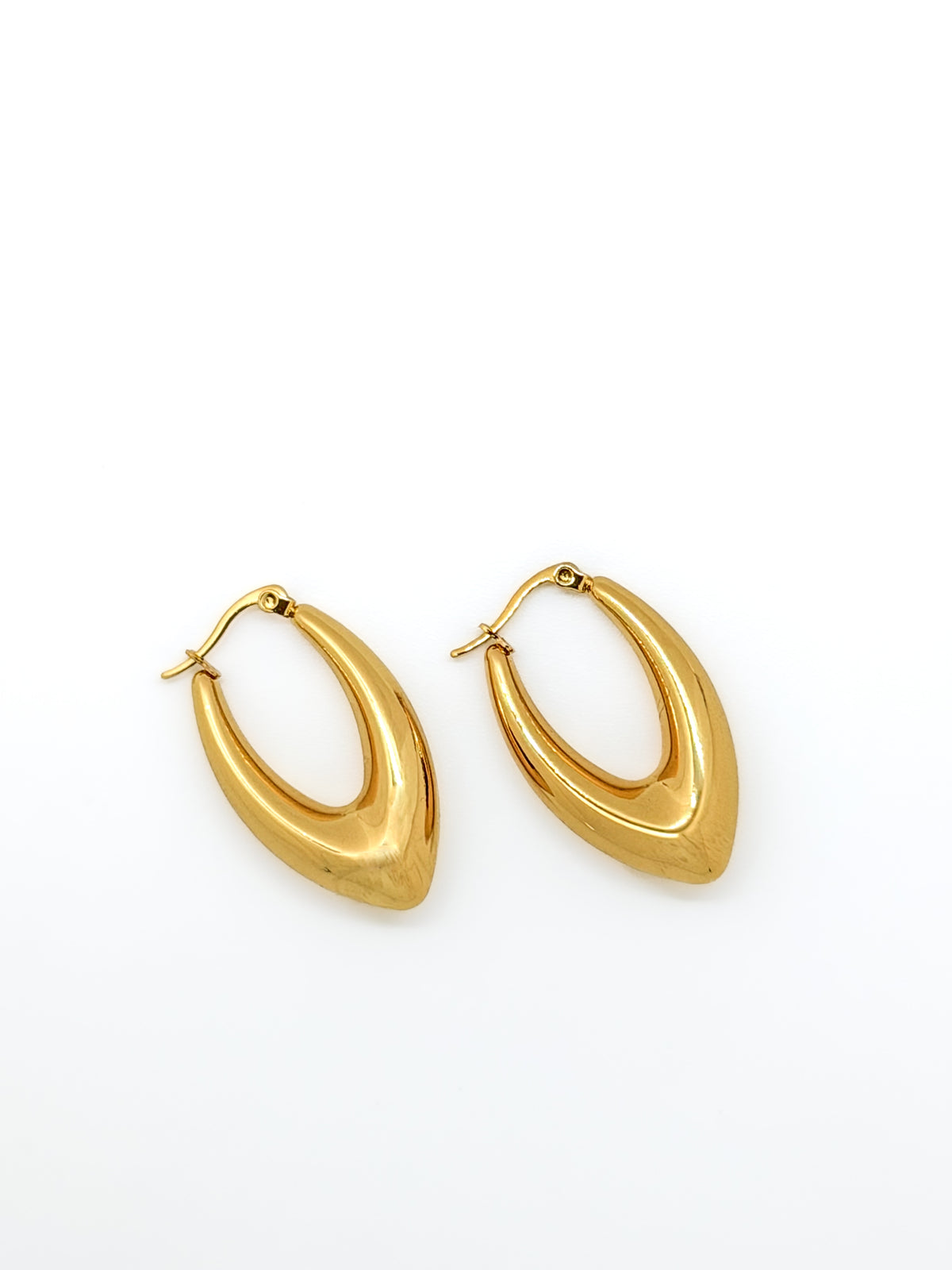 Tapered teardrop-shaped gold-plated hoop earrings.