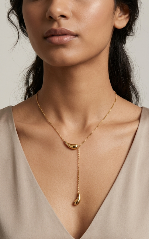 Rhea Liquid Teardrop Lariat Necklace 18K gold plated worn on Model.