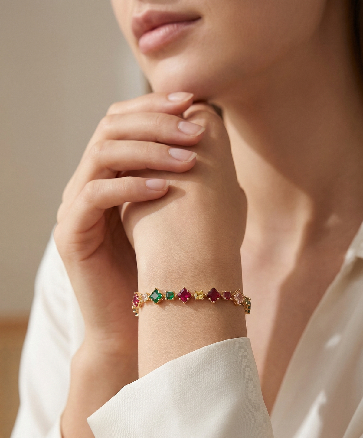 Model wearing Anti-tarnish 18K gold-plated multi-color square-stone bracelet.