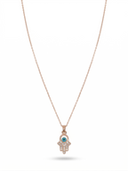 Anti-tarnish rose gold-plated Hamsa hand evil eye pendant necklace.